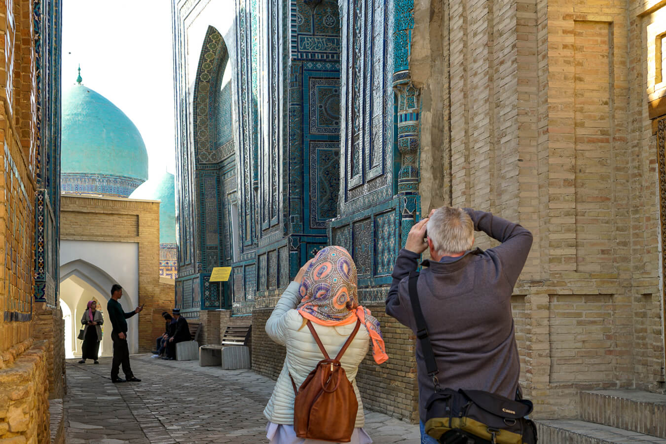 Shahizinda mausoleum photographed by tourists in Samarkand